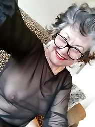 Fantastic mature grandma is fingering her leaking cunt